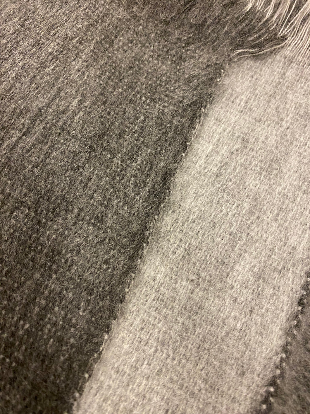 one side dark grey an another side ligth grey, baby alpaca throw. 